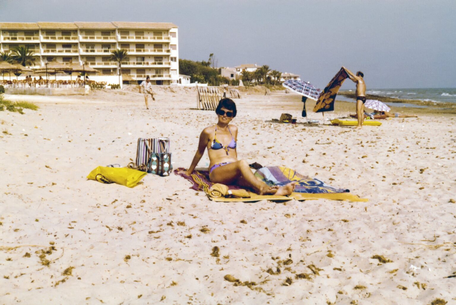 The original 1970s beach snapshot used for the Arsenault Dermatology skin check ad, before editing